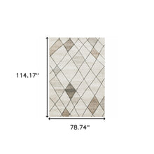 6' X 9' Beige Grey Tan And Brown Geometric Power Loom Stain Resistant Area Rug