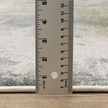 5' X 8' Blue Grey Green And Beige Abstract Power Loom Stain Resistant Area Rug