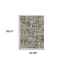 5' X 7' Blue And Beige Abstract Power Loom Stain Resistant Area Rug