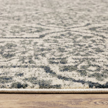 8' X 10' Ivory Blue And Sage Floral Power Loom Stain Resistant Area Rug