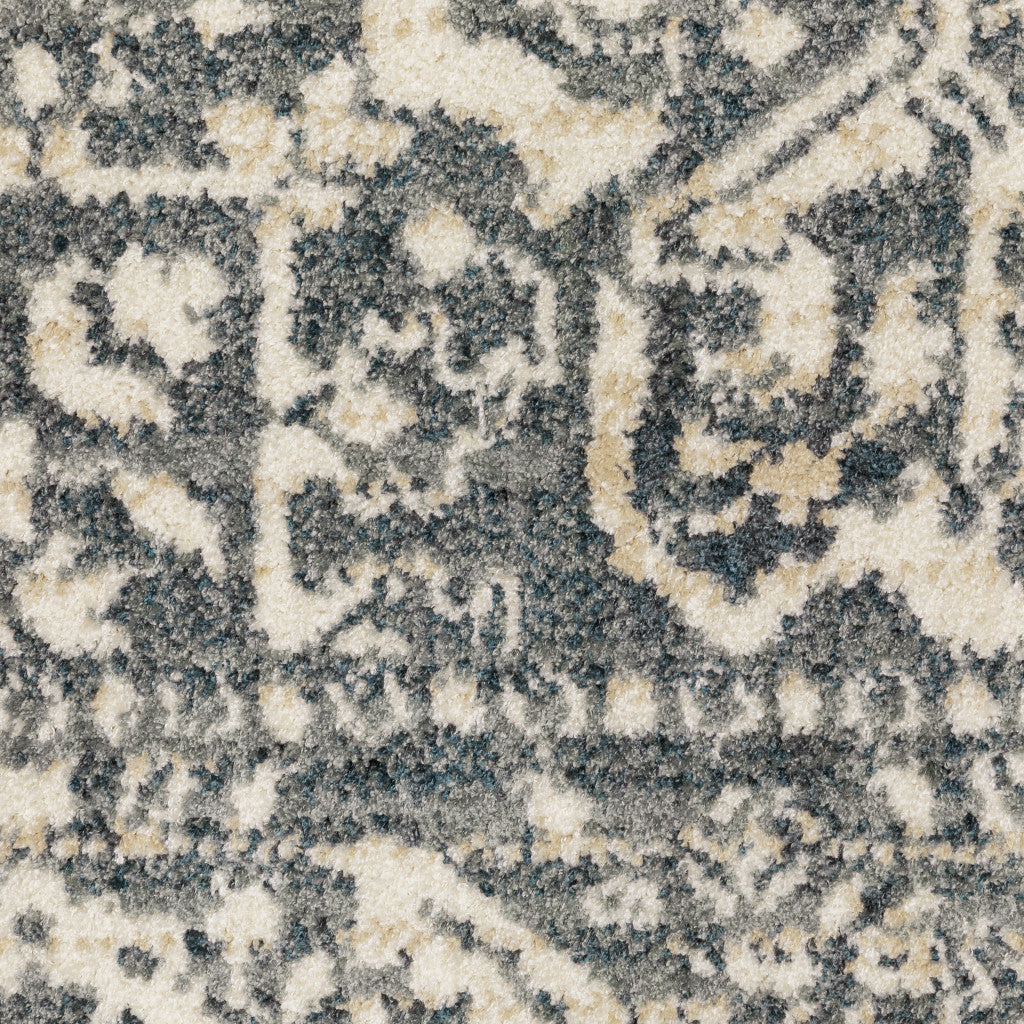 5' X 7' Beige Grey And Blue Oriental Power Loom Stain Resistant Area Rug