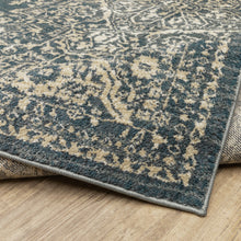 5' X 7' Beige Grey And Blue Oriental Power Loom Stain Resistant Area Rug