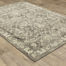5' X 8' Grey Beige Tan And Brown Oriental Power Loom Stain Resistant Area Rug