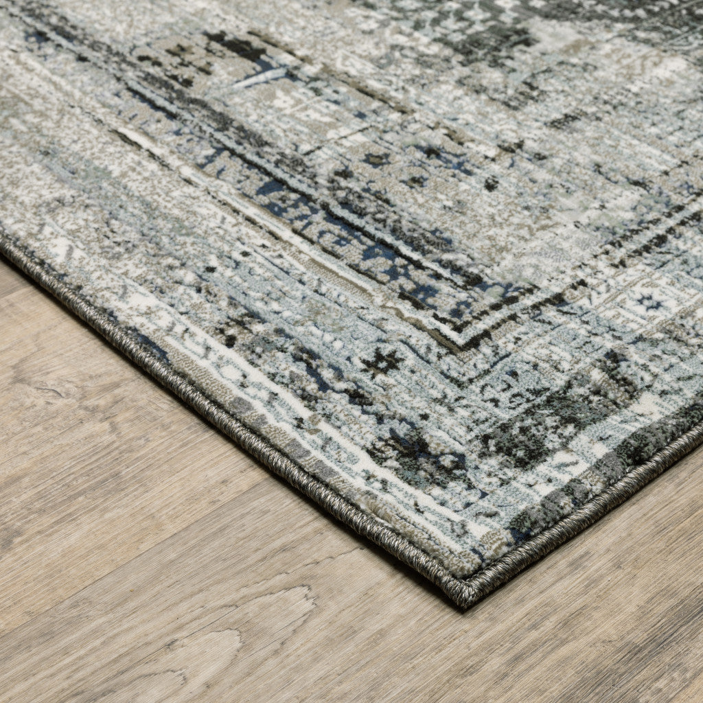 5' X 8' Charcoal Grey Blue Ivory And Taupe Oriental Power Loom Stain Resistant Area Rug