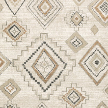 6' X 9' Ivory Orange Tan Black And Grey Southwestern Power Loom Stain Resistant Area Rug