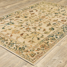 6' X 9' Beige Gold And Teal Oriental Power Loom Stain Resistant Area Rug