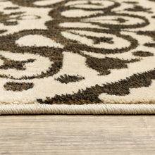 5' X 7' Beige Geometric Power Loom Stain Resistant Area Rug