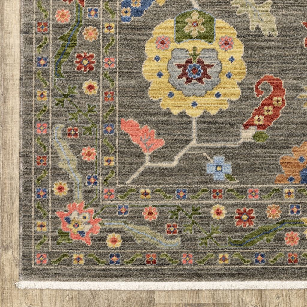 8' X 11' Grey Blue Pink Orange Rust Red Green And Ivory Oriental Power Loom Stain Resistant Area Rug With Fringe