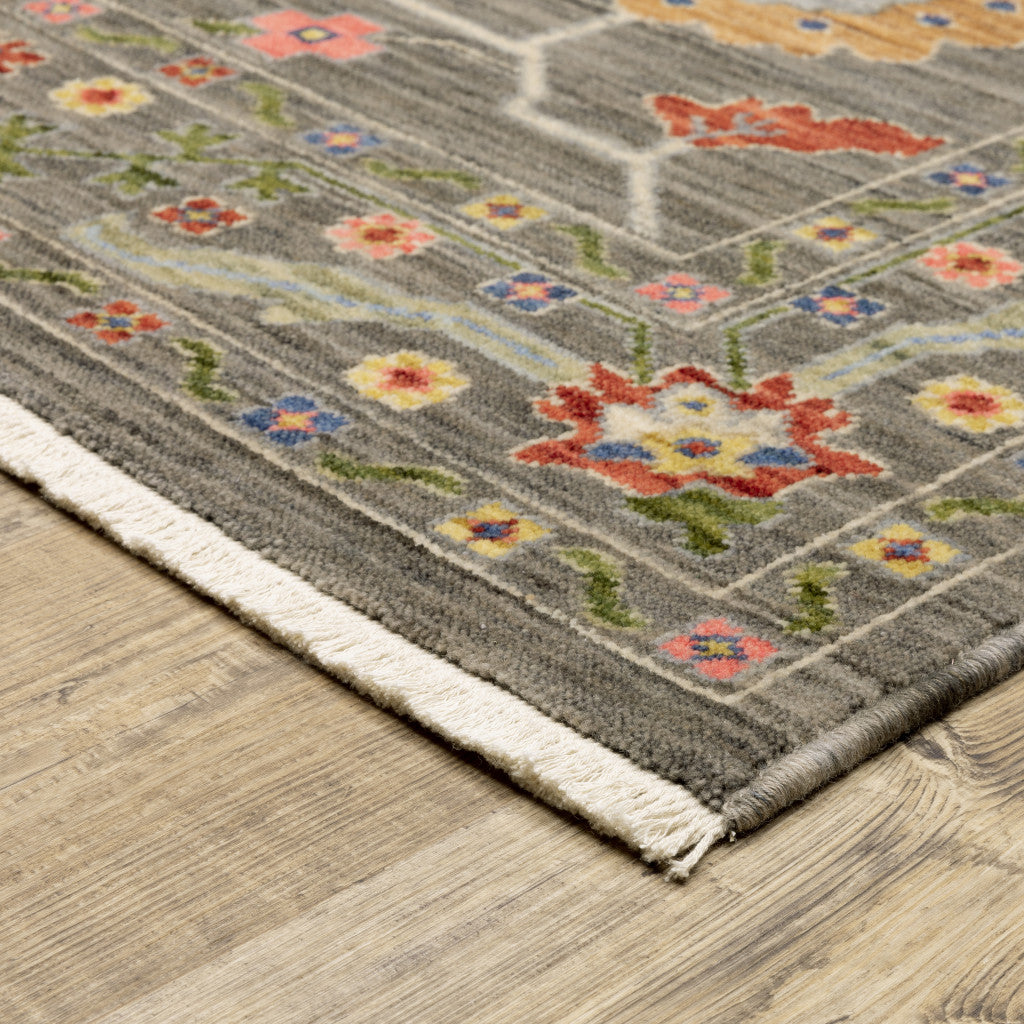 10' X 13' Grey Blue Pink Orange Rust Red Green And Ivory Oriental Power Loom Stain Resistant Area Rug With Fringe