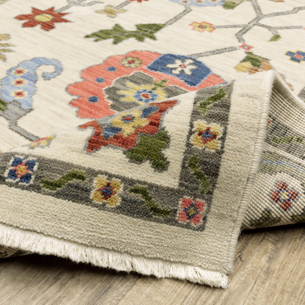 10' X 13' Ivory Green Blues Pink Yellow Rust Brown Tan And Grey Oriental Power Loom Stain Resistant Area Rug With Fringe