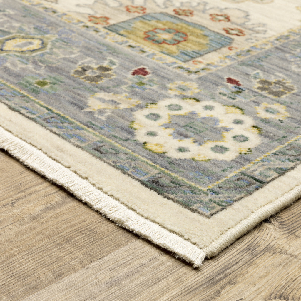 2' X 6' Ivory Blue Grey Teal Gold Green And Rust Oriental Power Loom Stain Resistant Runner Rug With Fringe