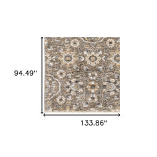 8' X 11' Grey And Tan Floral Power Loom Stain Resistant Area Rug With Fringe