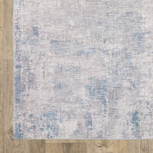 5' X 7' Grey And Blue Abstract Power Loom Stain Resistant Area Rug