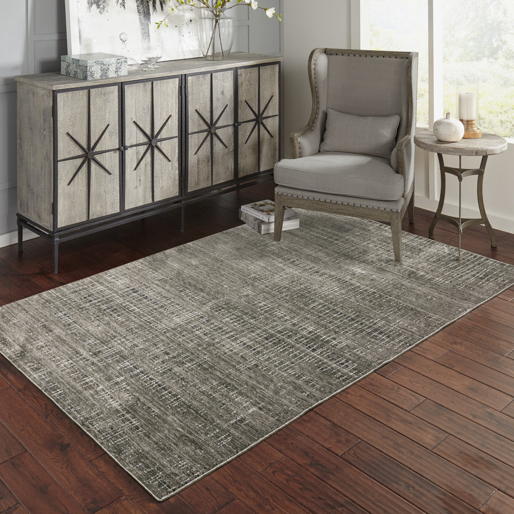 6' X 9' Charcoal Grey Grey Ivory Tan And Brown Abstract Power Loom Stain Resistant Area Rug