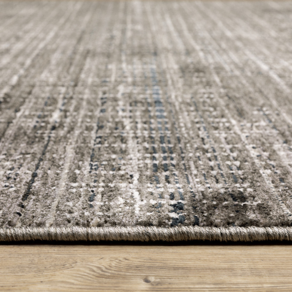 6' X 9' Charcoal Grey Grey Ivory Tan And Brown Abstract Power Loom Stain Resistant Area Rug