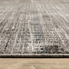 6' X 9' Charcoal Grey Grey Ivory Tan And Brown Abstract Power Loom Stain Resistant Area Rug