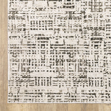 5' X 8' Ivory Grey Charcoal Brown And Beige Abstract Power Loom Stain Resistant Area Rug