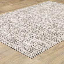6' X 9' Ivory Grey Charcoal Brown And Beige Abstract Power Loom Stain Resistant Area Rug