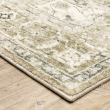 5' X 7' Tan Ivory Grey And Beige Oriental Power Loom Stain Resistant Area Rug