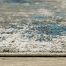 5' X 7' Blue Grey And Beige Abstract Power Loom Stain Resistant Area Rug