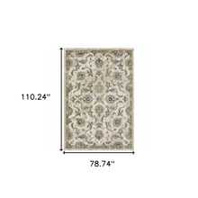 6' X 9' Beige Gold Blue And Grey Oriental Power Loom Stain Resistant Area Rug