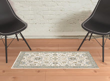 2' X 3' Stone Grey Ivory Green Brown Teal And Light Blue Oriental Power Loom Stain Resistant Area Rug