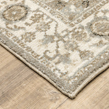 5' X 7' Grey Ivory Tan Brown And Gold Oriental Power Loom Stain Resistant Area Rug
