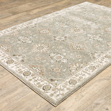 6' X 9' Grey Ivory Tan Brown And Gold Oriental Power Loom Stain Resistant Area Rug