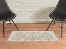 2' X 3' Beige Ivory Blue Green And Purple Oriental Power Loom Stain Resistant Area Rug