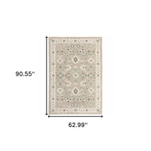 5' X 7' Beige Ivory Blue Green And Purple Oriental Power Loom Stain Resistant Area Rug