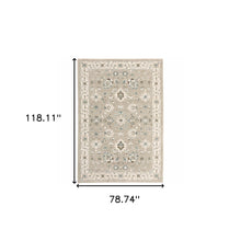 6' X 9' Beige Ivory Blue Green And Purple Oriental Power Loom Stain Resistant Area Rug