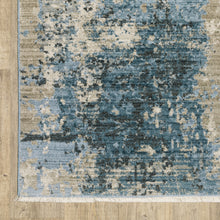 8' X 11' Blue Grey Ivory Light Blue And Dark Blue Abstract Power Loom Stain Resistant Area Rug With Fringe