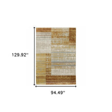 8' X 11' Rust Gold Blue Grey Ivory And Tan Geometric Power Loom Stain Resistant Area Rug With Fringe
