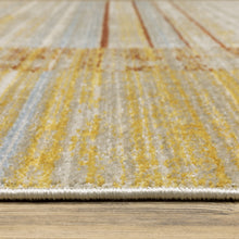 10' X 13' Rust Gold Blue Grey Ivory And Tan Geometric Power Loom Stain Resistant Area Rug With Fringe