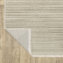 6' X 9' Ivory Beige Taupe And Tan Geometric Power Loom Stain Resistant Area Rug With Fringe