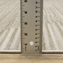 6' X 9' Ivory Beige Taupe And Tan Geometric Power Loom Stain Resistant Area Rug With Fringe