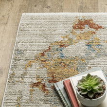 4' X 6' Beige Grey Gold Blue Rust And Teal Abstract Power Loom Stain Resistant Area Rug With Fringe