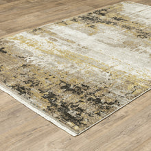 4' X 6' Grey Gold Black Charcoal And Beige Abstract Power Loom Stain Resistant Area Rug With Fringe