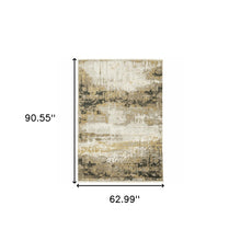 5' X 8' Grey Gold Black Charcoal And Beige Abstract Power Loom Stain Resistant Area Rug With Fringe