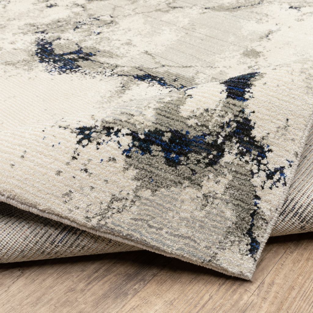 5' X 7' Grey Black And Ivory Abstract Power Loom Stain Resistant Area Rug