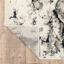 8' X 10' Grey Black And Ivory Abstract Power Loom Stain Resistant Area Rug