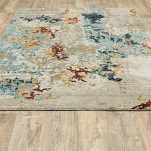 6' X 9' Beige And Blue Abstract Power Loom Stain Resistant Area Rug