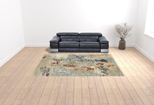 9' X 12' Beige And Blue Abstract Power Loom Stain Resistant Area Rug