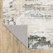 5' X 7' Gray And Ivory Abstract Printed Stain Resistant Non Skid Area Rug
