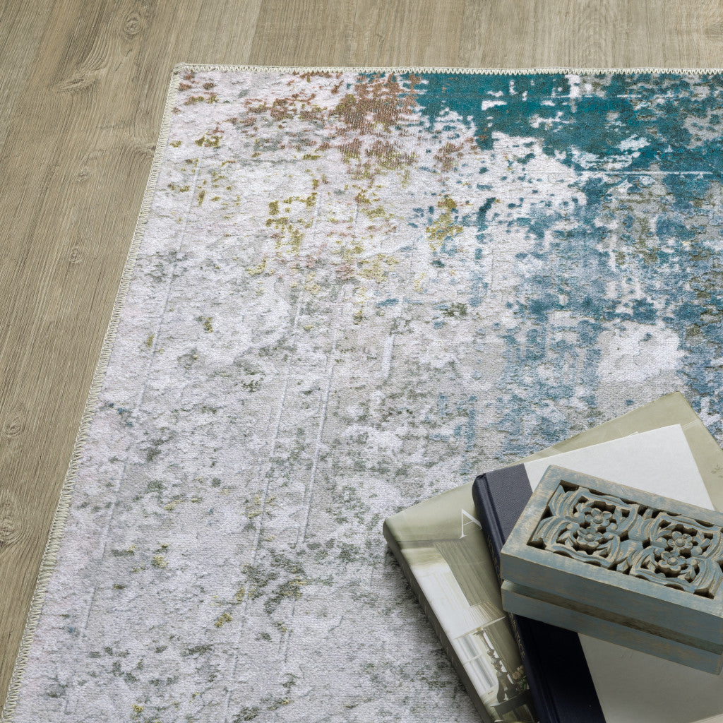 8' X 10' Ivory Teal Blue Grey Brown And Gold Abstract Printed Stain Resistant Non Skid Area Rug