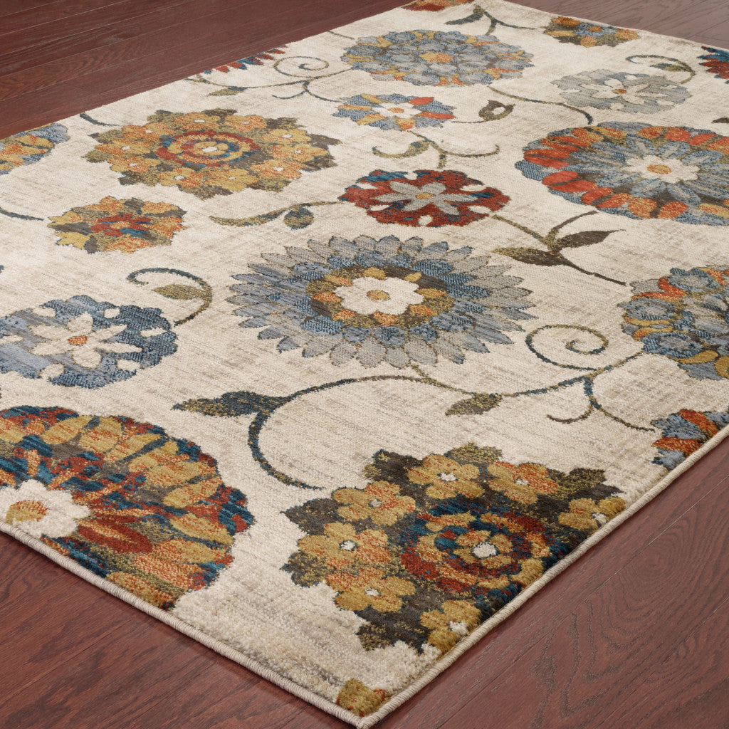 5' X 8' Ivory Blue Gold Green Orange Rust And Teal Floral Power Loom Stain Resistant Area Rug