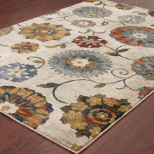 5' X 8' Ivory Blue Gold Green Orange Rust And Teal Floral Power Loom Stain Resistant Area Rug