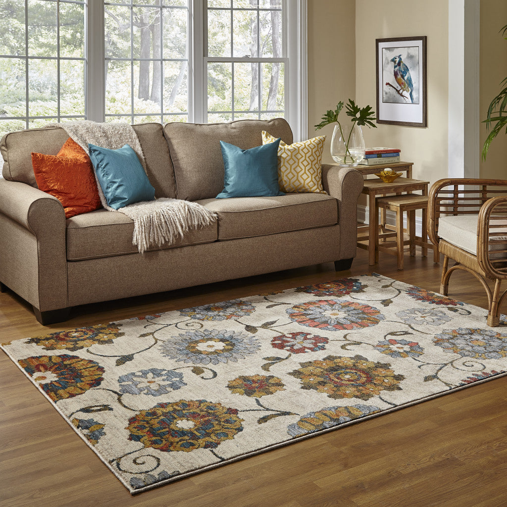6' X 9' Ivory Blue Gold Green Orange Rust And Teal Floral Power Loom Stain Resistant Area Rug