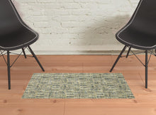 2' X 3' Green Blue Ivory Beige And Light Blue Abstract Power Loom Stain Resistant Area Rug