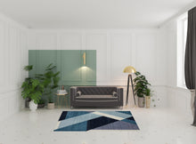 5' X 7' Blue Purple Grey And Teal Geometric Power Loom Area Rug